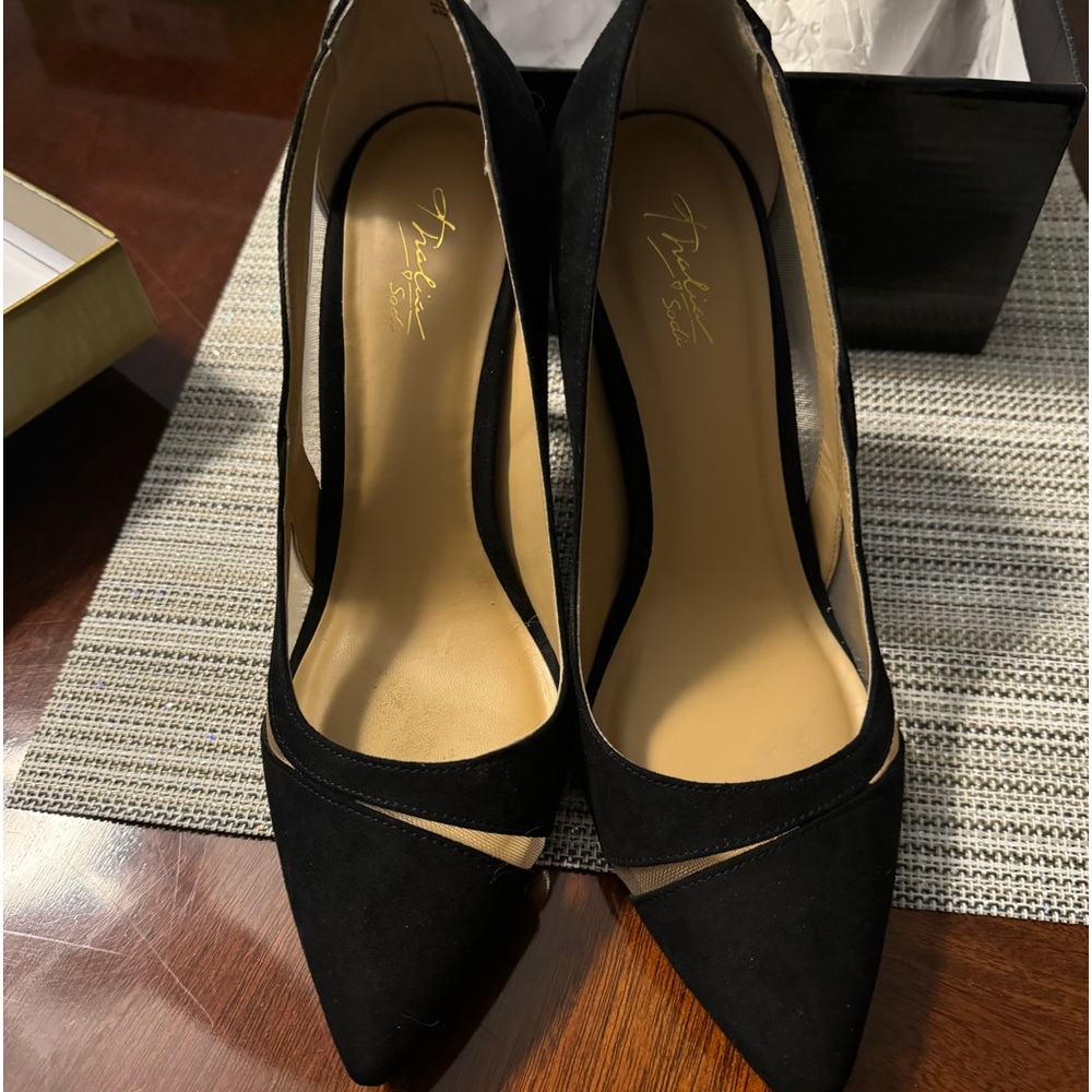 Beautiful black suede heels with mesh openings. 3 1/2 inch heel.  Like new.